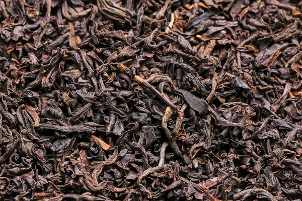 Fondo de té negro Imágenes de stock libres de derechos