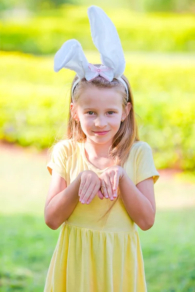 Adorable little girl wearing bunny ears on Easter — Stock Photo, Image