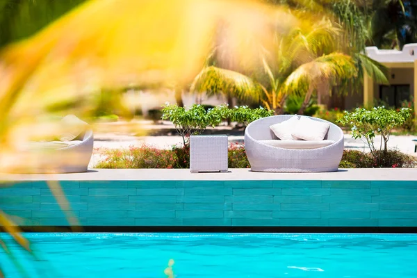 Beautiful luxury umbrella beach and chair around swimming in hotel resort — Stock Photo, Image