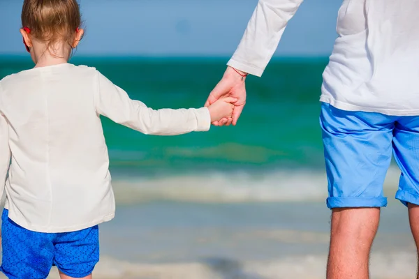 Close up of father holding his daughter hand — Stock Photo, Image