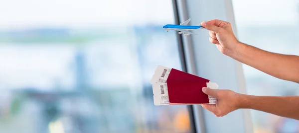 Closeup passports and boarding pass at airport indoor — Stock Photo, Image