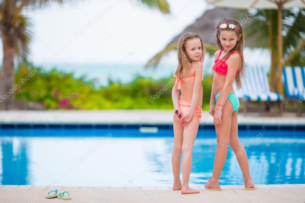teens playing by pool Teens playing by pool