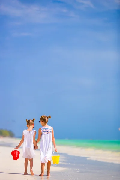 Little adorable girls on white beach — Stock Photo, Image