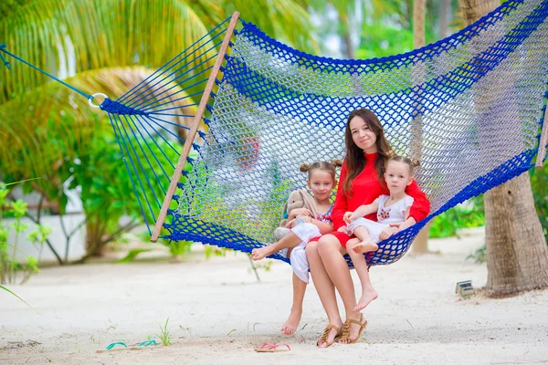 Mother and two kids at summer vacation in exotic resort — Stock Photo, Image