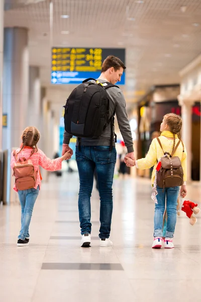 Happy family with two kids in airport have fun waiting for boarding — Stock Photo, Image