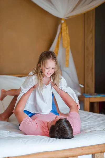 Father and adorable little girl having fun at home — Stock Photo, Image