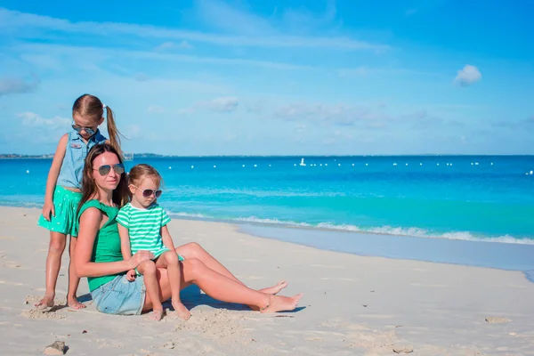 Mother and daughters enjoying time at tropical beach — Stock Photo, Image