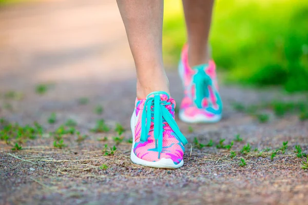 Healthy active lifestyle woman athlete tying running shoes. Sporty girl getting ready for jogging workout. Closeup of running shoes. — Stock Photo, Image