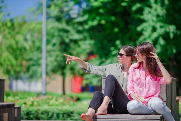 Happy young urban girls in european city. Caucasian beautiful women having fun together outdoors — Stock Photo, Image