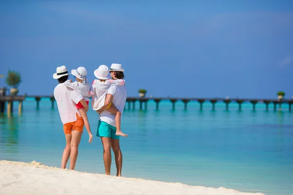 Happy beautiful family on white beach — Stock Photo, Image