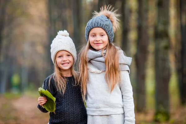 Little adorable girls outdoors at warm sunny autumn day — Stock Photo, Image