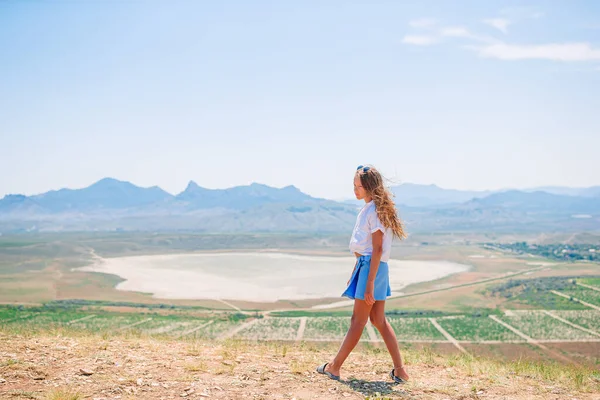 Kid on vacation on white rock background — Stock Photo, Image