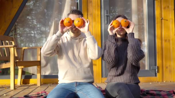 Щаслива сім'я з двох на терасі восени — стокове відео