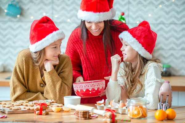 Happy family mother and daughter bake cookies for Christmas — Stock Photo, Image