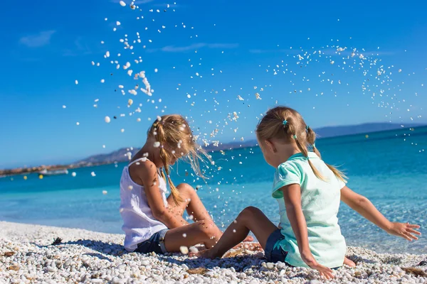 Adorable cute girls have fun on white beach during vacation — Stock Photo, Image