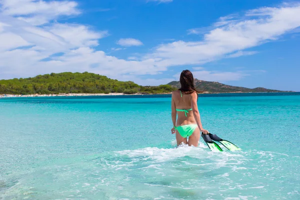 Young woman running into tropical blue sea with snorkeling gear — Stock Photo, Image