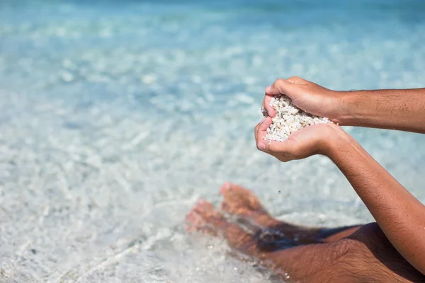 Hands in the form of heart with pebbles inside — Stock Photo, Image