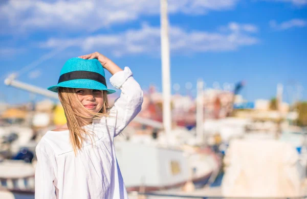 Adorable little girl have fun in a port on summer day — Stock Photo, Image