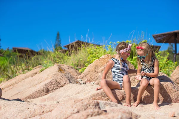 Adorable cute girls have fun on white beach during vacation — Stock Photo, Image