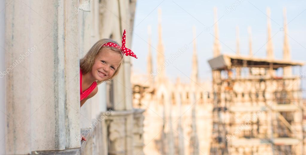 Adorable little girl on the rooftop of Duomo, Milan, Italy