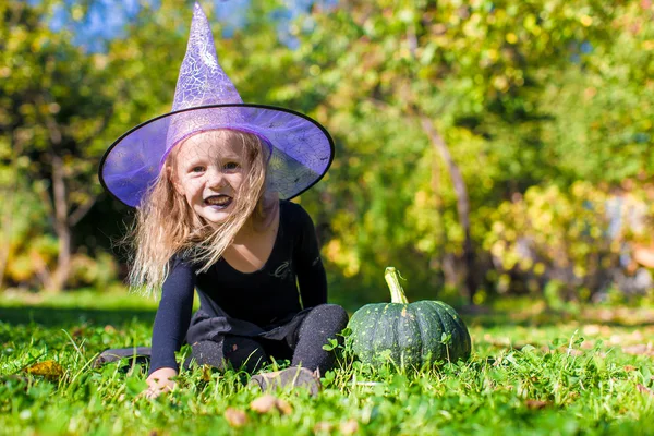 Cute little girl in Halloween which costume have fun outdoor — Stock Photo, Image