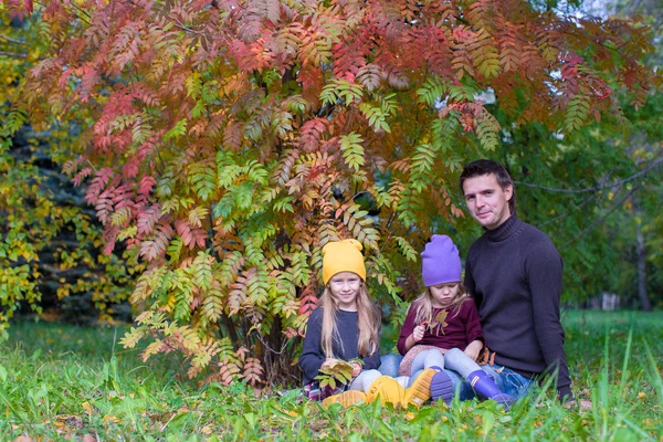 Happy family in autumn park outdoors — Stock Photo, Image