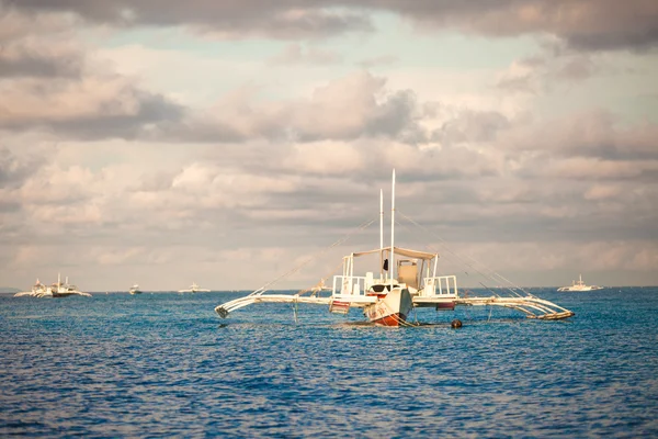 Big catamaran in turquoise open  sea near Bohol island — Stock Photo, Image