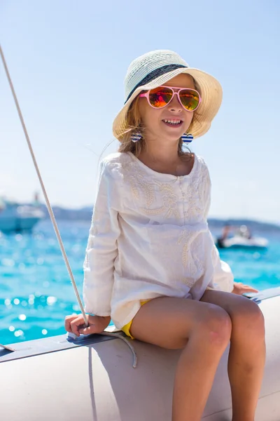 Little girl enjoying sailing on boat in the open sea — Stock Photo, Image
