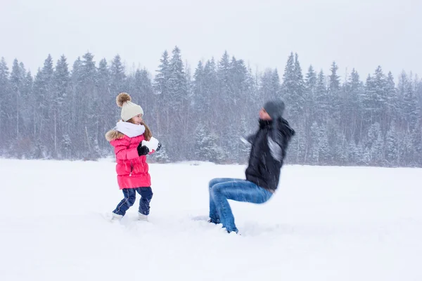 Happy family have fun in winter snowy day — Stock Photo, Image