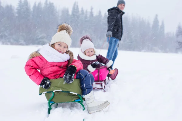 Happy family in winter outdoors — Stock Photo, Image