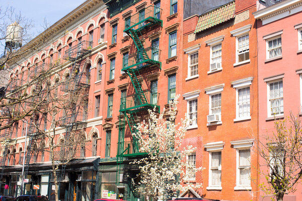Old houses with stairs in historic district of West Village