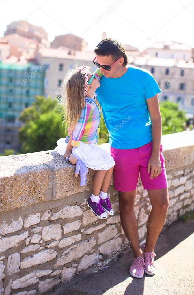 Father and her little daughter outdoors in Bonifacio city, Corsica