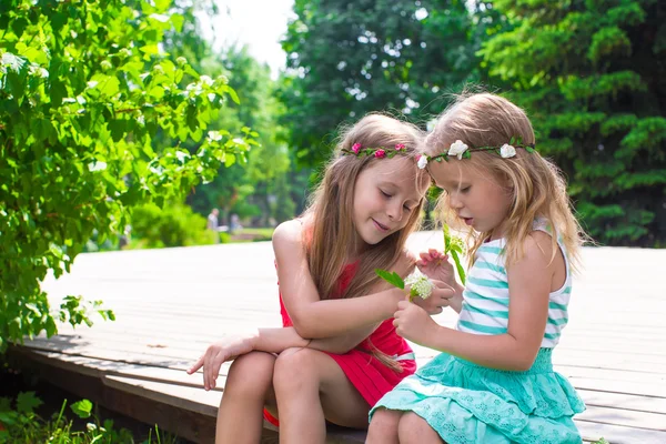 Happy adorable little girls enjoying warm summer day — Stock Photo, Image