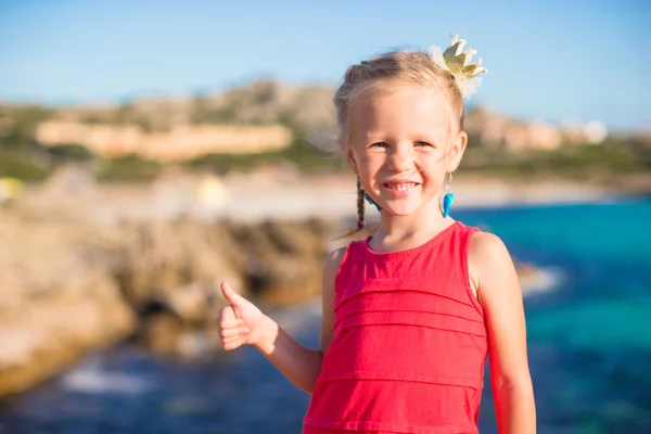 Adorable little girl have fun at tropical beach Stock Photo