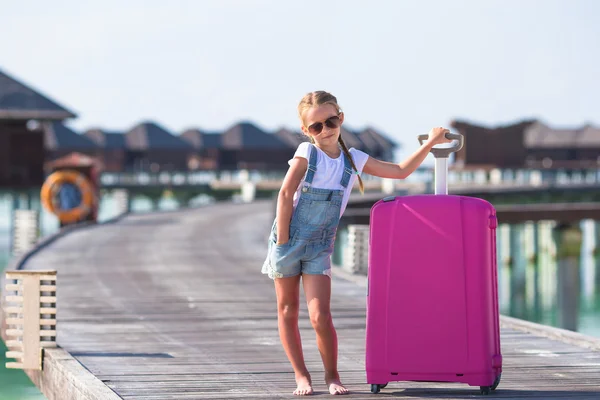 Little adorable girl with big luggage during summer vacation — Stock Photo, Image