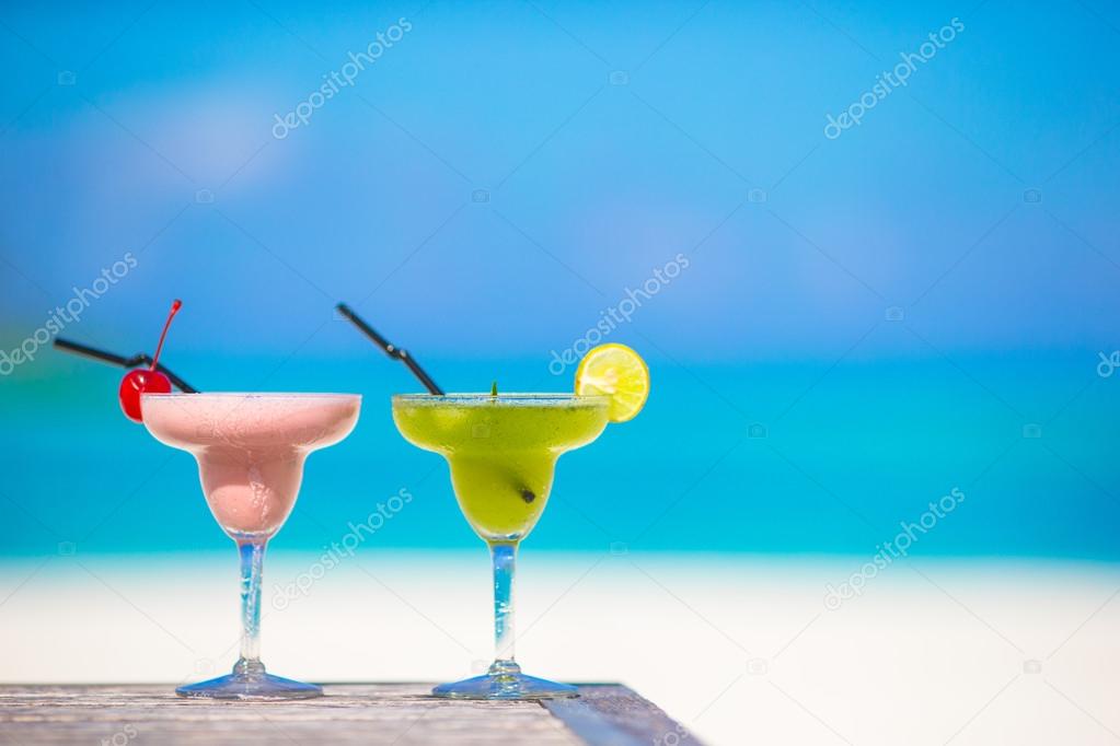 Two tasty cocktails on tropical white beach