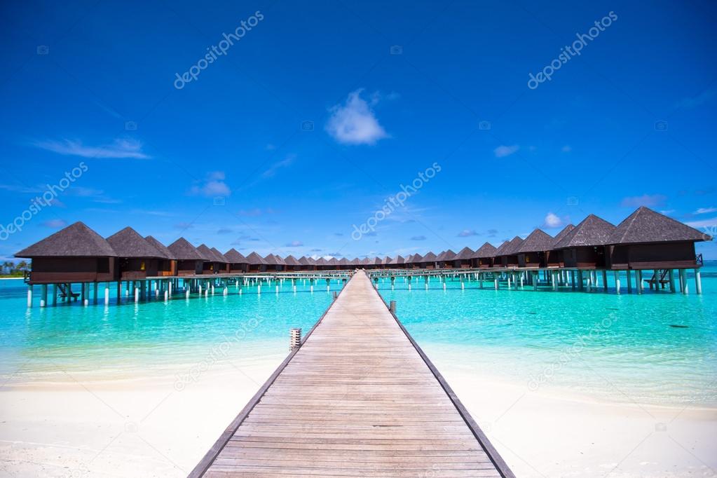 Water bungalows and wooden jetty on Maldives