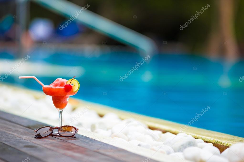 Tasty cocktail background swimming pool