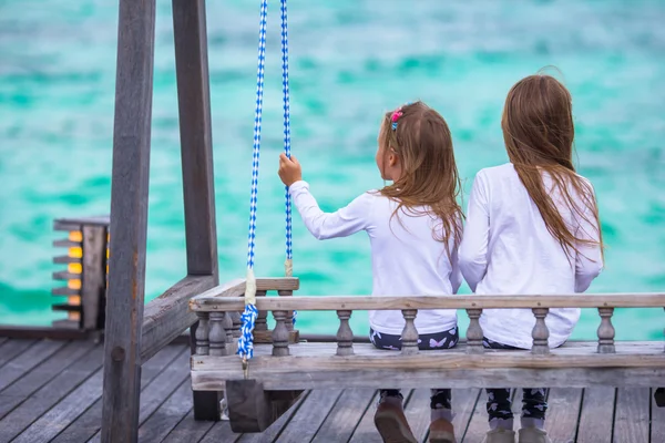 Adorable little girls having fun during beach vacation — Stock Photo, Image