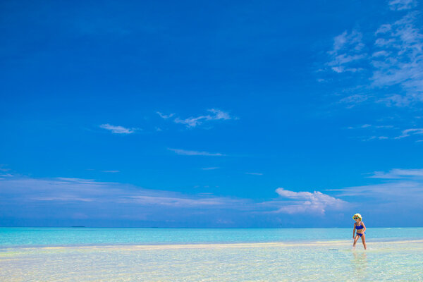 Young beautiful woman on beach during tropical vacation