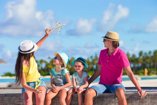 Family vacation. Airplane in woman hand.