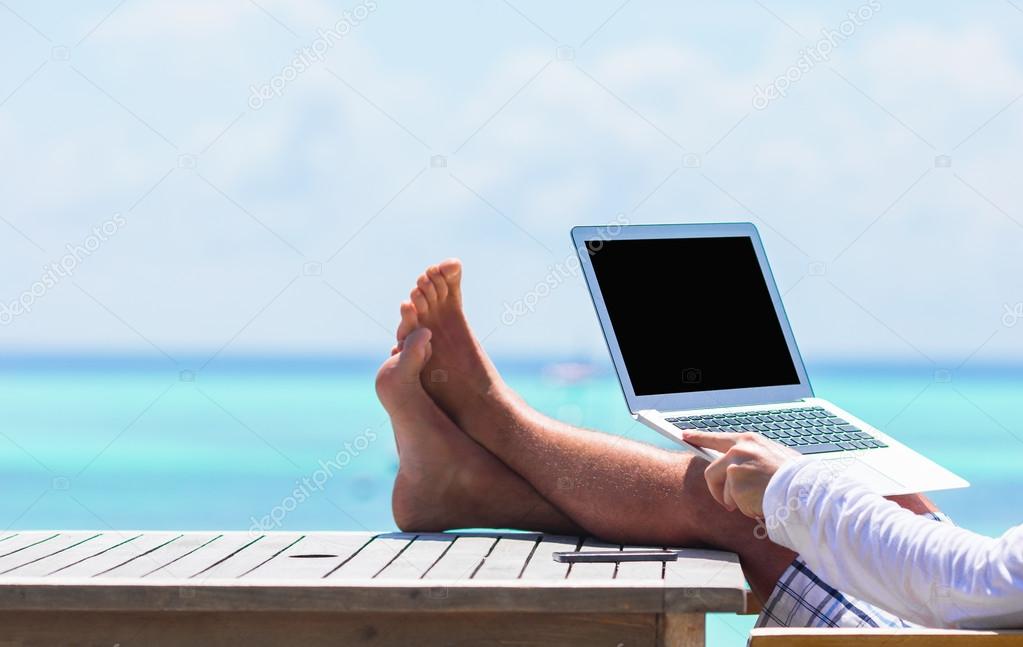 Closeup of computer on table background the sea