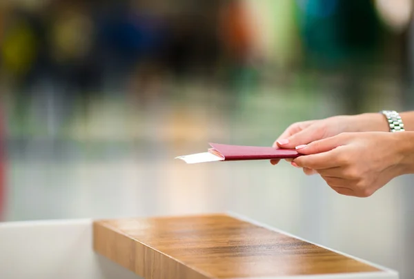 Closeup passports and boarding pass at airport indoor — Stock Photo, Image