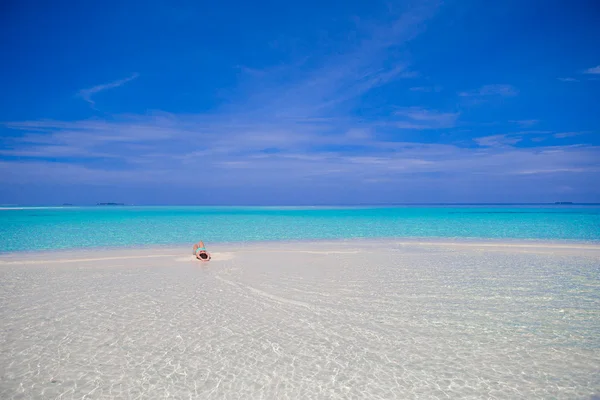 Young beautiful woman at shallow tropical water — Stock Photo, Image