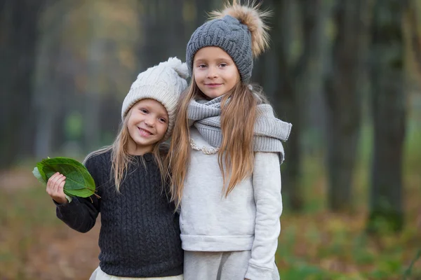 Adorable girls outdoors at warm sunny autumn day — Stock Photo, Image