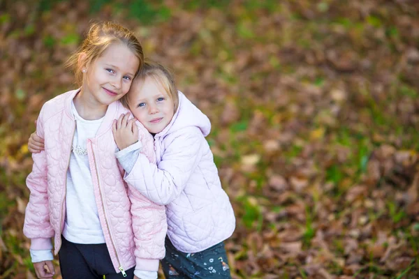 Little adorable girls outdoors at warm autumn day — Stock Photo, Image