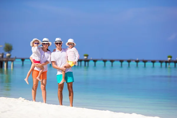 Happy beautiful family on a tropical beach vacation — Stock Photo, Image