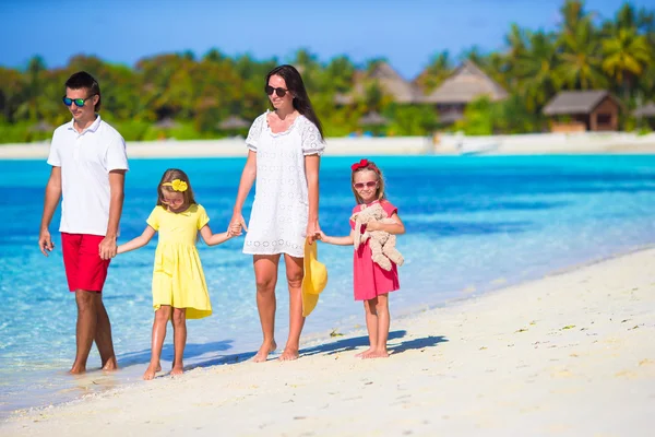 Happy beautiful family on a tropical beach vacation — Stock Photo, Image