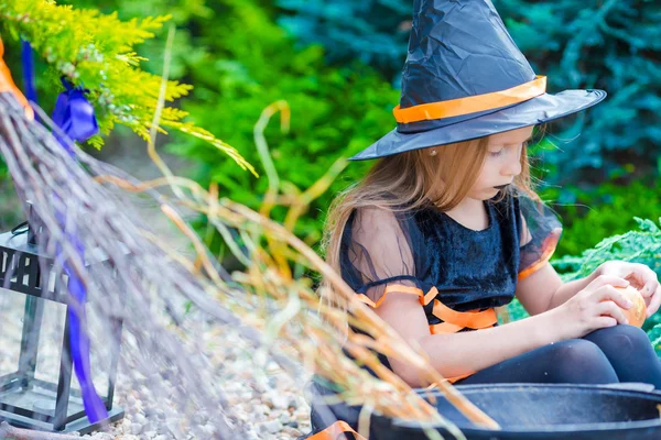 Little adorable girl in halloween costume with big onion outdoor — Stock Photo, Image