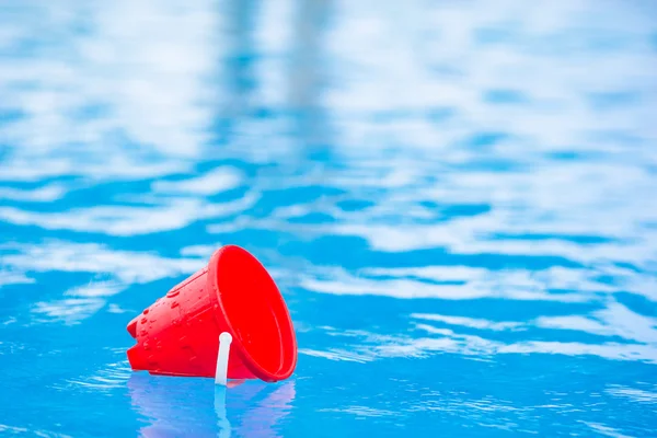 Plastic beach kids toys at the swimming pool on vacation — Stock Image Plastic beach kids toys at the swimming pool on vacation Stock Picture